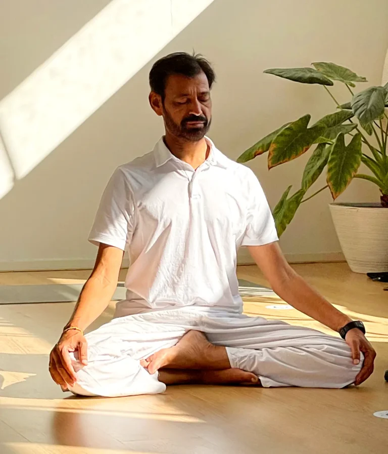 In This Image a men do 300 Hour Yoga Teacher Training In Goa